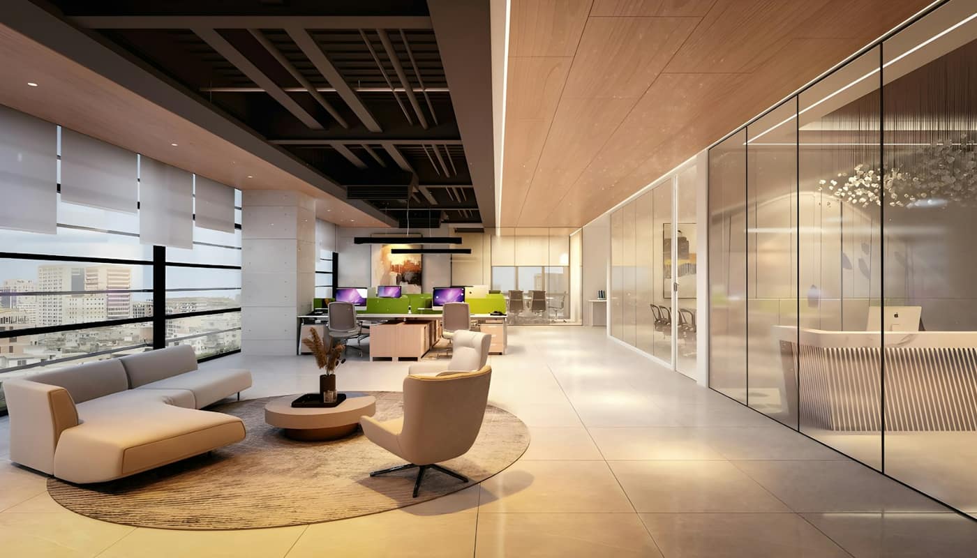 A bright modern office lounge with sofas and glass-walled meeting rooms
